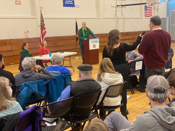 Ron listening to an audience member at a town hall