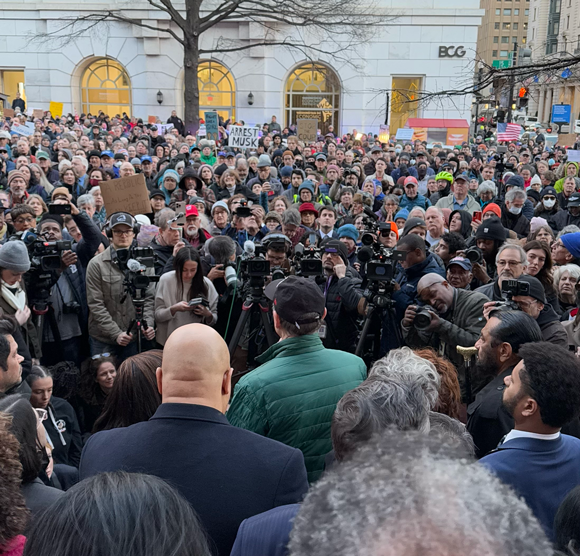 Ron speaking to a crowd outside Treasury